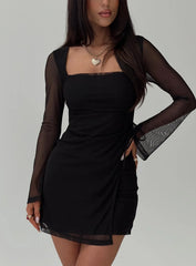 Model wearing a black mesh sleeve mini dress from the front