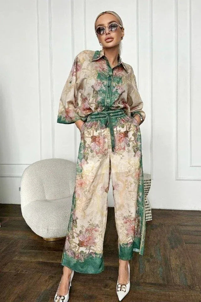woman wearing a floral print two-piece set with a button-down shirt and wide-leg pants