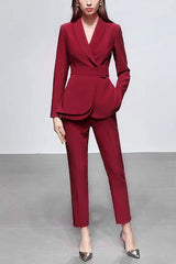 Full-length view of a woman in a red formal suit, showcasing the blazer's belted waist and peplum detail.