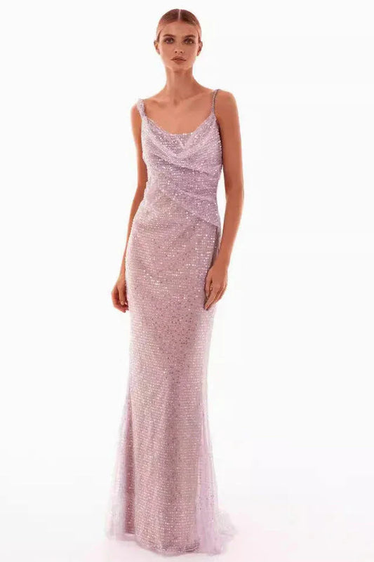 A woman models a sparkling lavender floor-length gown with a cowl neckline and spaghetti straps, front view.