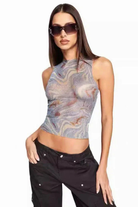 Woman wearing a marble print mesh tank top and black cargo pants