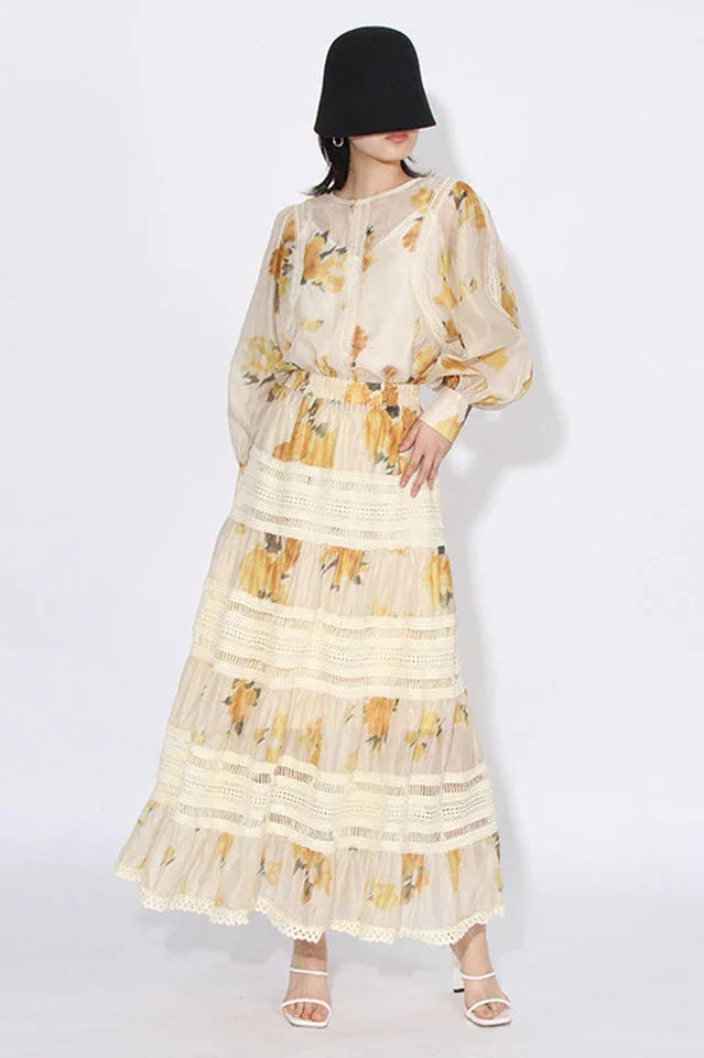 Woman wearing a yellow floral print maxi dress from the front