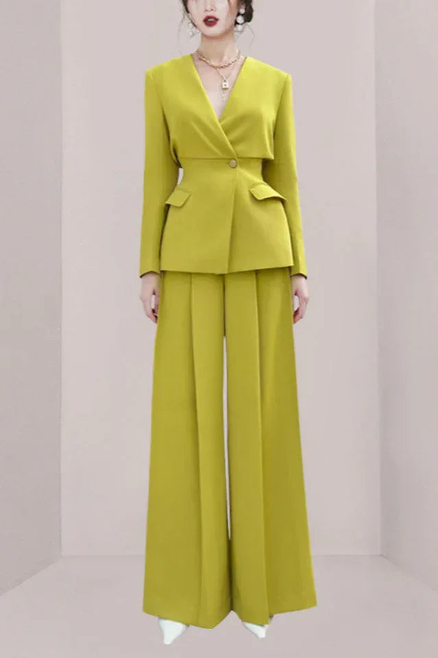 Woman wearing a lime green pantsuit with wide-leg pants and a lapel blazer.