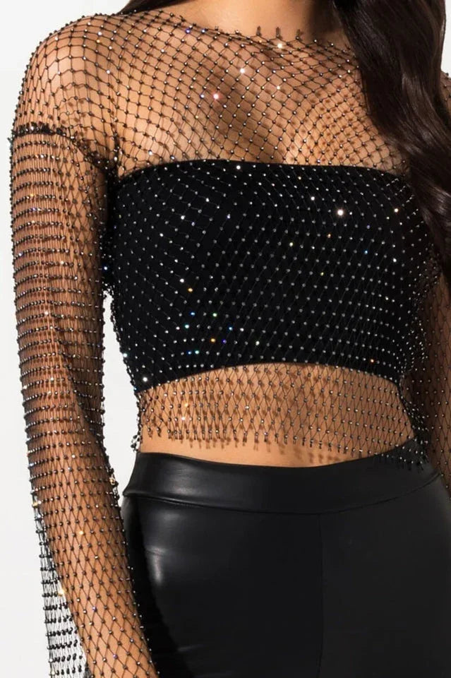 Close-up of the sparkling embellishments on the sheer crop top.
