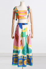 Mannequin displaying a sleeveless crop top and maxi skirt set with an abstract pattern