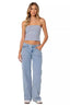 Woman wearing a blue and white striped tube top and light wash wide leg jeans