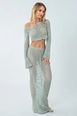 Woman wearing a light blue crochet knit crop top and maxi skirt set, side view.