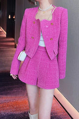 Woman in a pink tweed outfit with a handbag