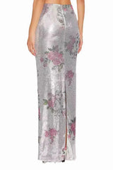Back view of the silver sequined maxi skirt with a floral print, showing the slit.