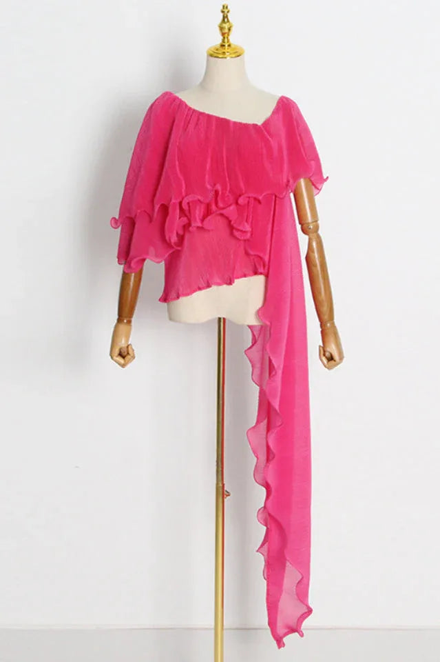 pink pleated ruffled top displayed on a mannequin