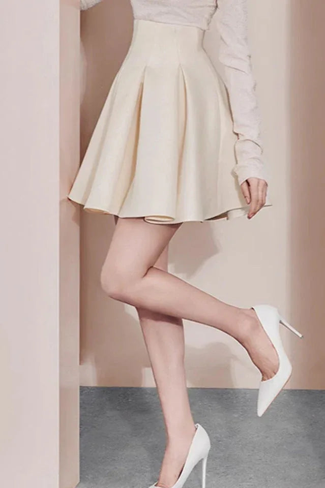 Close-up of the model's legs and shoes, showcasing the skirt's flare