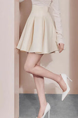 Close-up of the model's legs and shoes, showcasing the skirt's flare