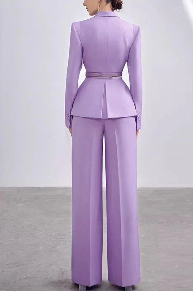 Back view of a woman in a lavender peplum suit with wide-leg trousers
