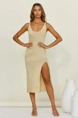 Woman posing in a beige knit midi dress with a high slit and scoop neck