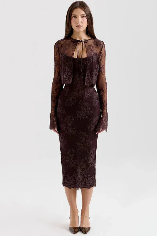 Woman wearing a dark brown lace midi dress with a matching long-sleeved lace bolero jacket
