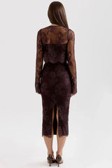 Back view of a woman in a dark brown lace midi dress with a slit and a matching lace bolero