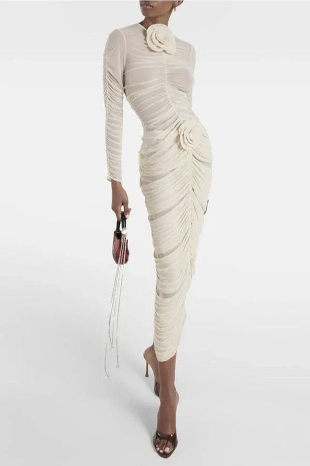 Full length view of a woman in a cream ruched mesh dress with floral accents