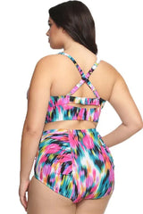 Back view of a plus-size model in a colorful abstract print high-waisted bikini