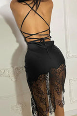 detail of the back of a black satin slip dress with intricate strap design