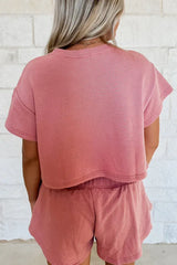 back view of a woman in a pink loungewear set