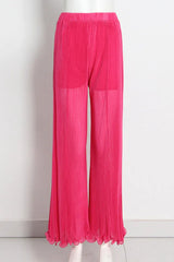 pink pleated wide-leg pants displayed on a mannequin