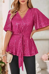 Pink sequined V-neck top with flutter sleeves and tie-front detail