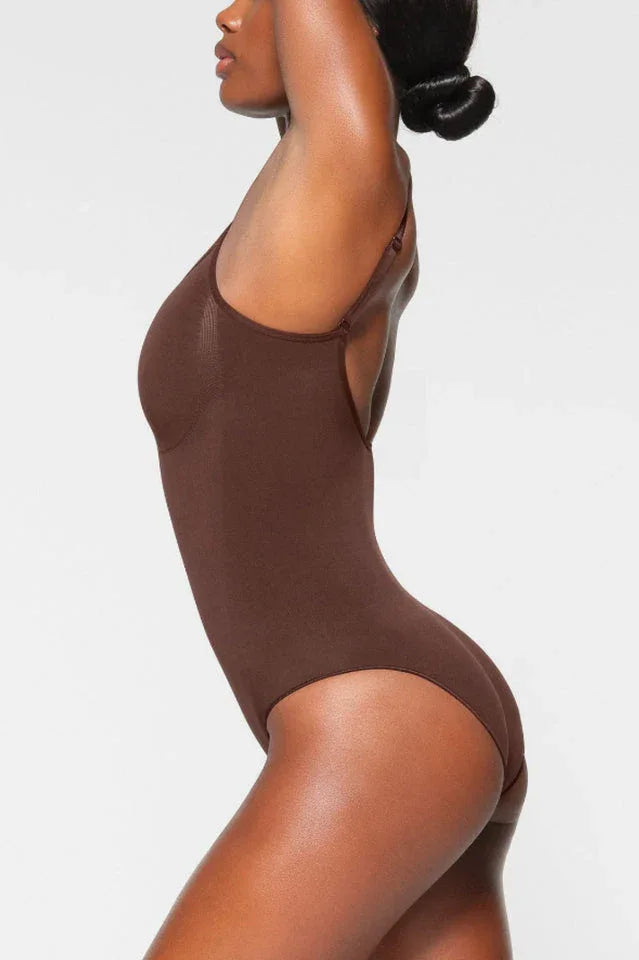 Woman wearing a brown seamless shaping bodysuit from the side