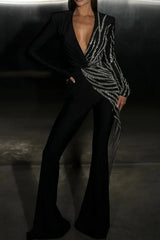 Close-up of the black jumpsuit, highlighting the intricate sequin details and the draped effect.