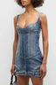 Close-up of the blue denim corset mini dress, showing the paneled bodice and sweetheart neckline.