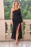 Woman wearing a black one-shoulder ruched dress with a high slit and a long sheer sleeve.