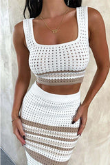 Close-up of the woman's torso showing the detail of the white and tan striped knit cropped tank top