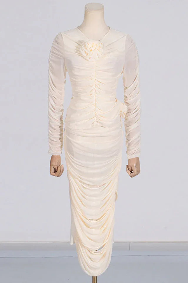 Cream ruched mesh dress with floral detail displayed on a mannequin
