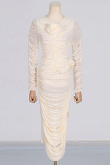 Cream ruched mesh dress with floral detail displayed on a mannequin
