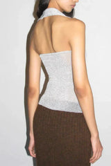 Back view of a silver sparkly halter top with a halter neckline.