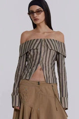 Model wearing an off-the-shoulder striped top and sunglasses