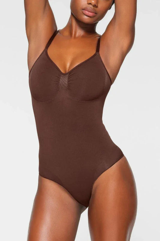 Woman wearing a brown seamless shaping bodysuit from the front