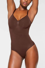Woman wearing a brown seamless shaping bodysuit from the front