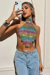 Woman taking a selfie while wearing a rainbow halter crop top.