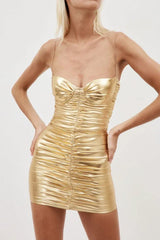 Close-up front view of a woman's torso in a gold metallic ruched mini dress with a sweetheart neckline and thin straps.