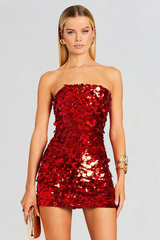 Woman wearing a red sequined strapless mini dress, front view