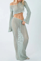 Close-up of a woman wearing a light blue crochet knit crop top and maxi skirt set, showing the drawstring detail.