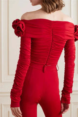 Back view of the red off-the-shoulder top, showing the ruched detailing and zipper closure.