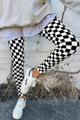 Close-up of black and white checkerboard leggings