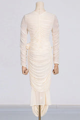 Back view of a cream ruched mesh dress on a mannequin