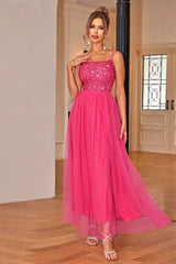 woman in a hot pink sequined and tulle evening gown
