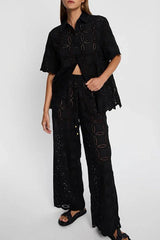 Close-up of a woman wearing a black embroidered outfit