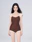 Woman wearing a brown and cream one-piece swimsuit with ruffled cap sleeves and a sweetheart neckline, shown from the front.