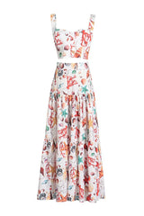 Front view of a white seashell print cropped halter top and a tiered maxi skirt.