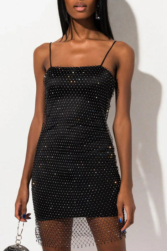 Woman wearing a black rhinestone bodycon mini dress with spaghetti straps