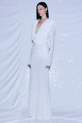 Full-length view of a white draped gown on a mannequin.